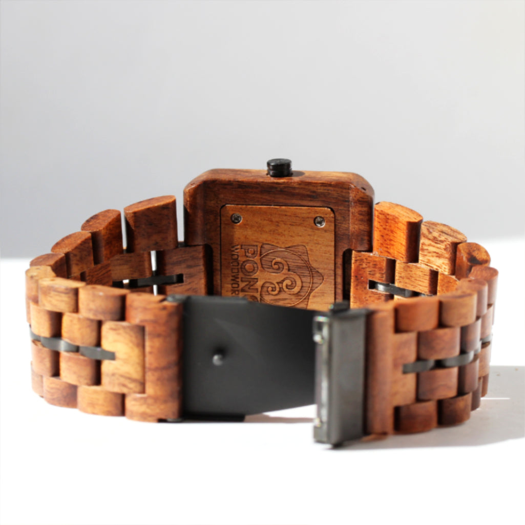 closeup of open clasp and koa wood band