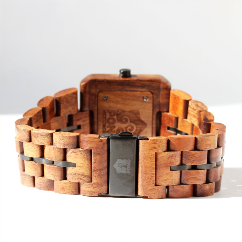 closeup of closed clasp and solid koa band