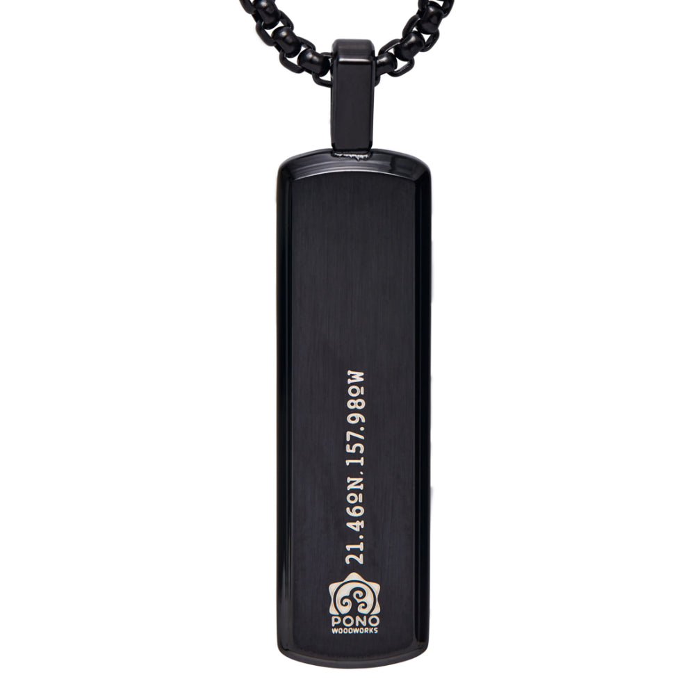 back of koa pendant with logo and longitude and latitude of the shop