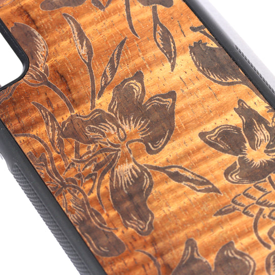 closeup of flower laser design on koa wood