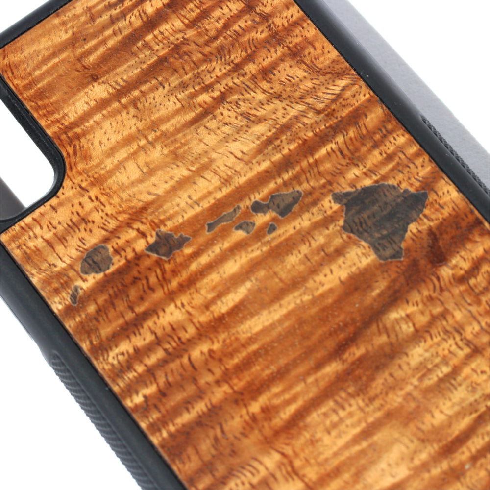 close up of laser island design on curly koa