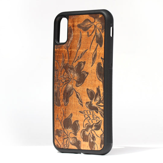 koa wood inlay phone case standing upright showing a flower design laser etched