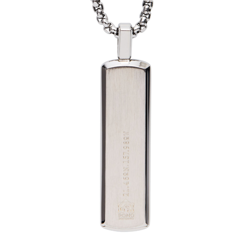 back of silver koa pendant showing logo and longitude and latitude of the shop