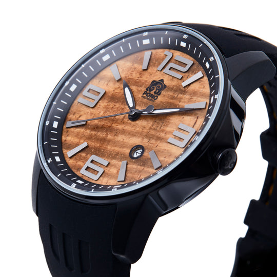 3/4 side view of koa wood face watch with black body and black silicone band