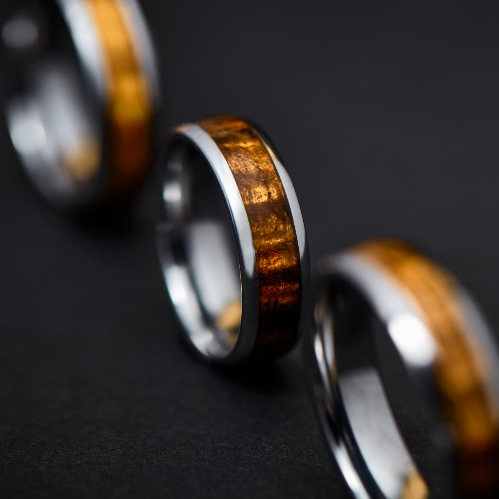 line of three koa inlay wood rings to show amazing wood grain