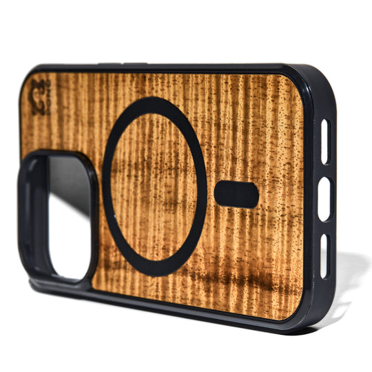 magsafe compatible koa wood phone case stood on edge w/ selective focus