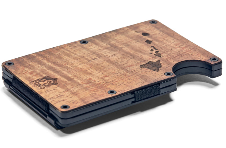 Koa Wood minimalist wallet laid flat on table