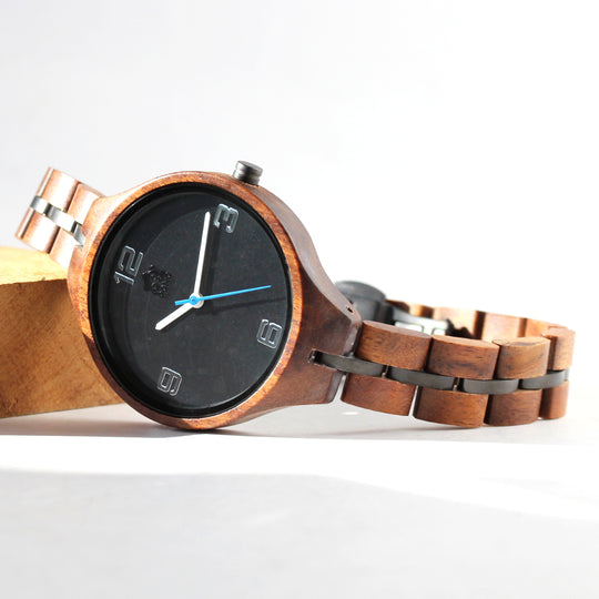 minimalist womens koa wood watch lying on side