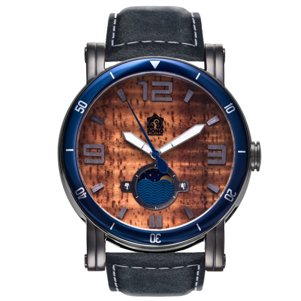 waterman Koa face watch in gunmetal stainless steel showing the design details of water design moon-phase, paddle shaped second hand, sailing winch crown, blue leather band