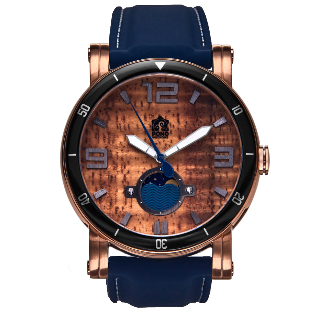 waterman Koa face watch in rose-gold stainless steel showing the design details of water design moon-phase, paddle shaped second hand, sailing winch crown, navy silicone band