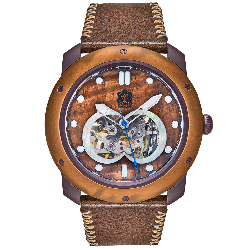 front view of automatic skeleton movement koa wood watch with bronze bezel and gunmetal stainless body, brown leather band