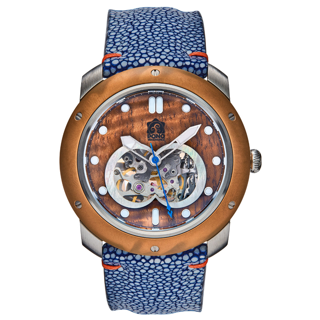 front view of automatic skeleton movement koa wood watch with bronze bezel and silver stainless body, blue stingray leather band