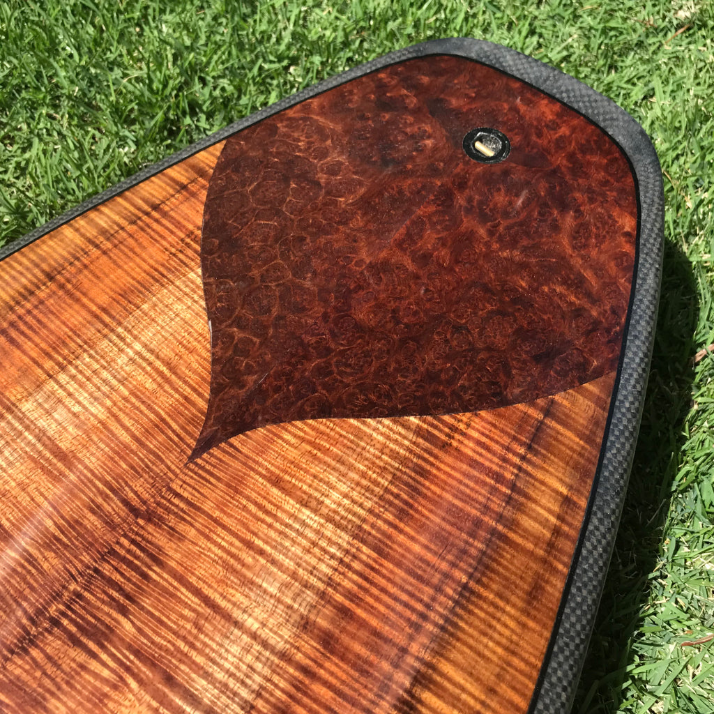 koa wood and redwood burl detail on surfboard