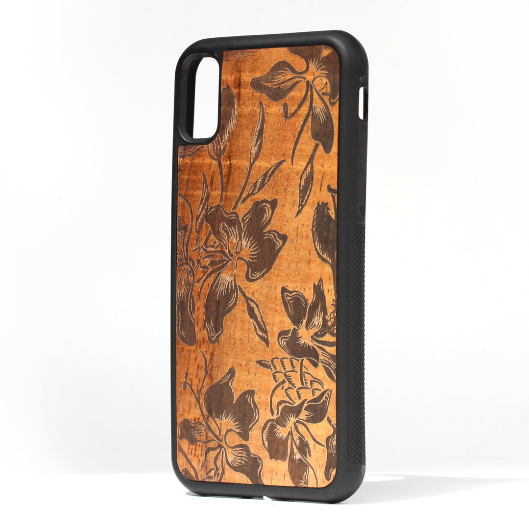 koa wood inlay phone case standing upright showing a flower design laser etched 