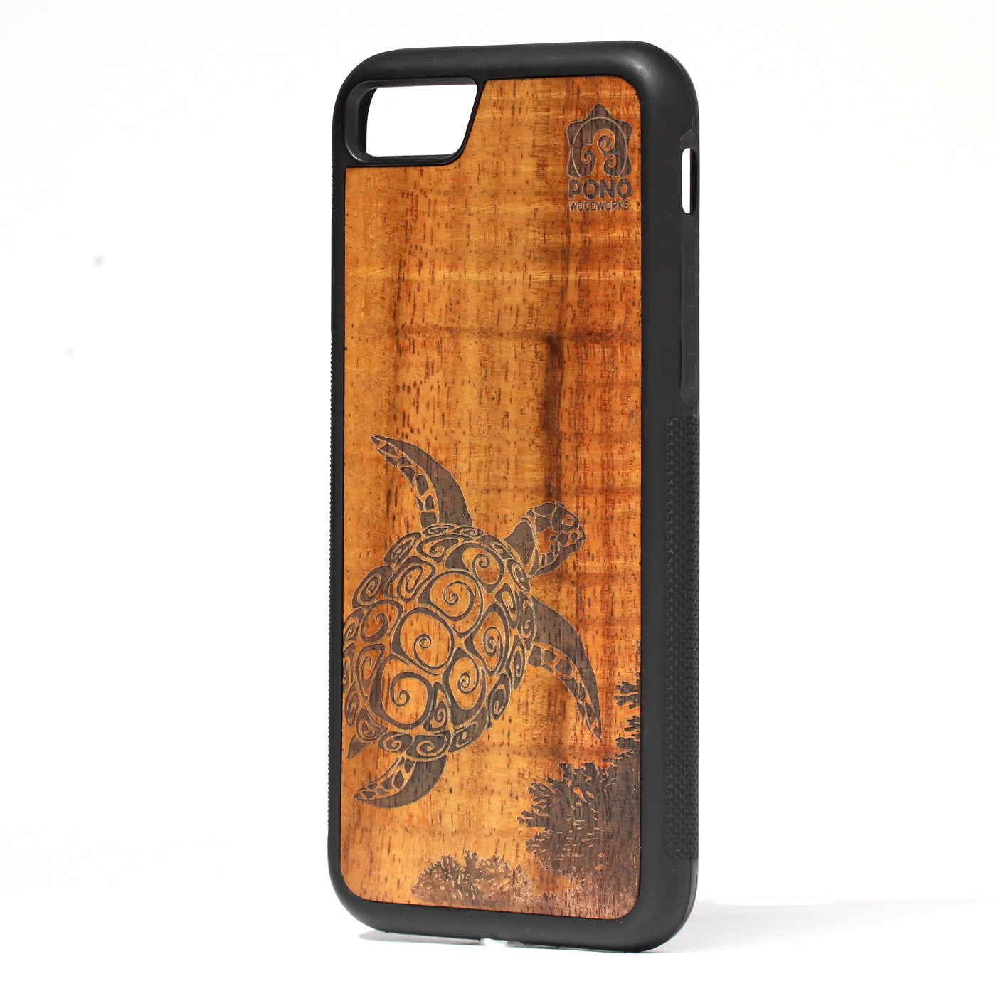 curly koa wood inlay phone case standing upright showing a turtle design laser etched