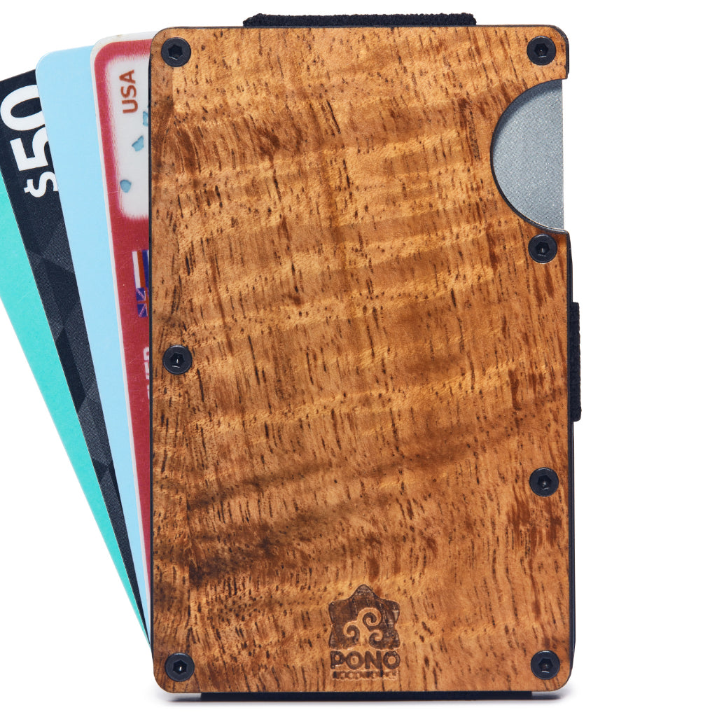 front view of koa wood face minimalist wallet with credit cards fanned out from the wallet