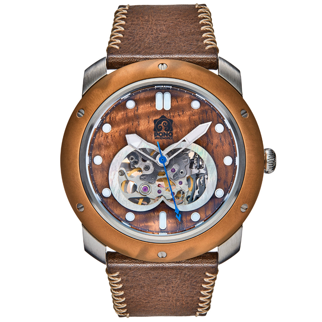 front view of automatic skeleton movement koa wood watch with bronze bezel and silver stainless body, brown leather band