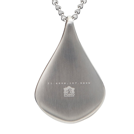 back of koa water drop shaped pendant showing logo and longitude latitude engraving
