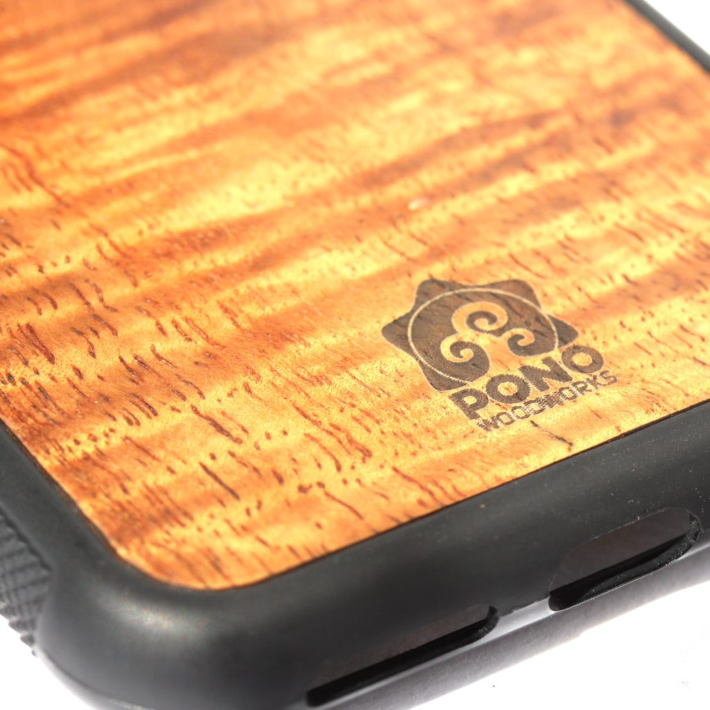 close up of pono woodworks logo on koa wood