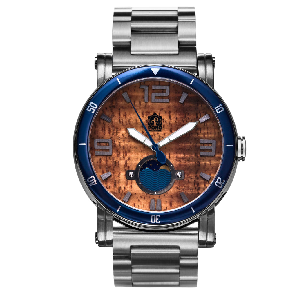waterman Koa face watch in silver stainless steel showing the design details of water design moon-phase, paddle shaped second hand, sailing winch crown, stainless steel band
