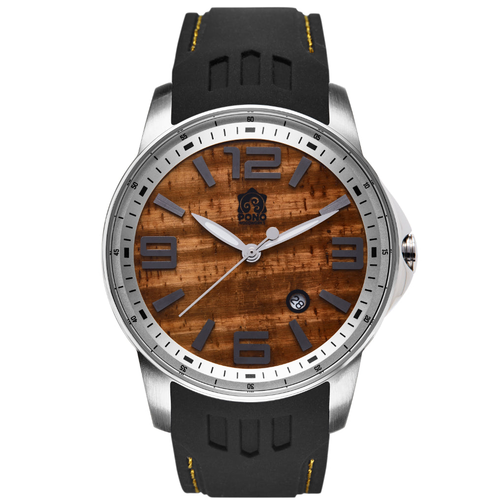 closeup showing silver version Surfrider Koa wood watch highlighting design details of wave crown, surfboard shaped hands, black silicone band