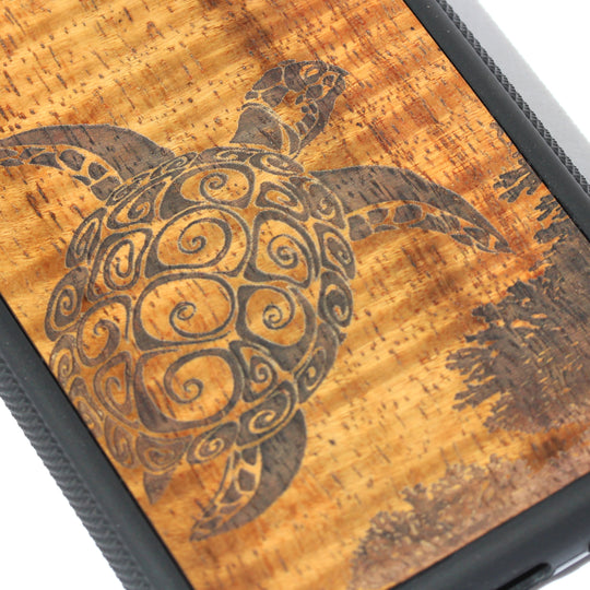 detail of honu laser etching on koa wood phone case